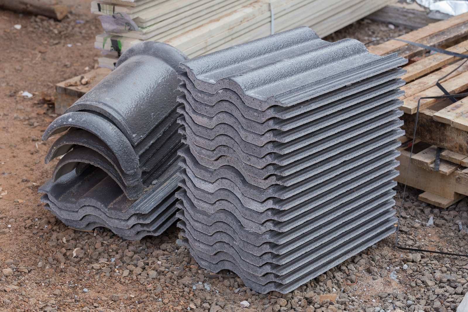stack of new concrete roof tile (gray color) at construction site