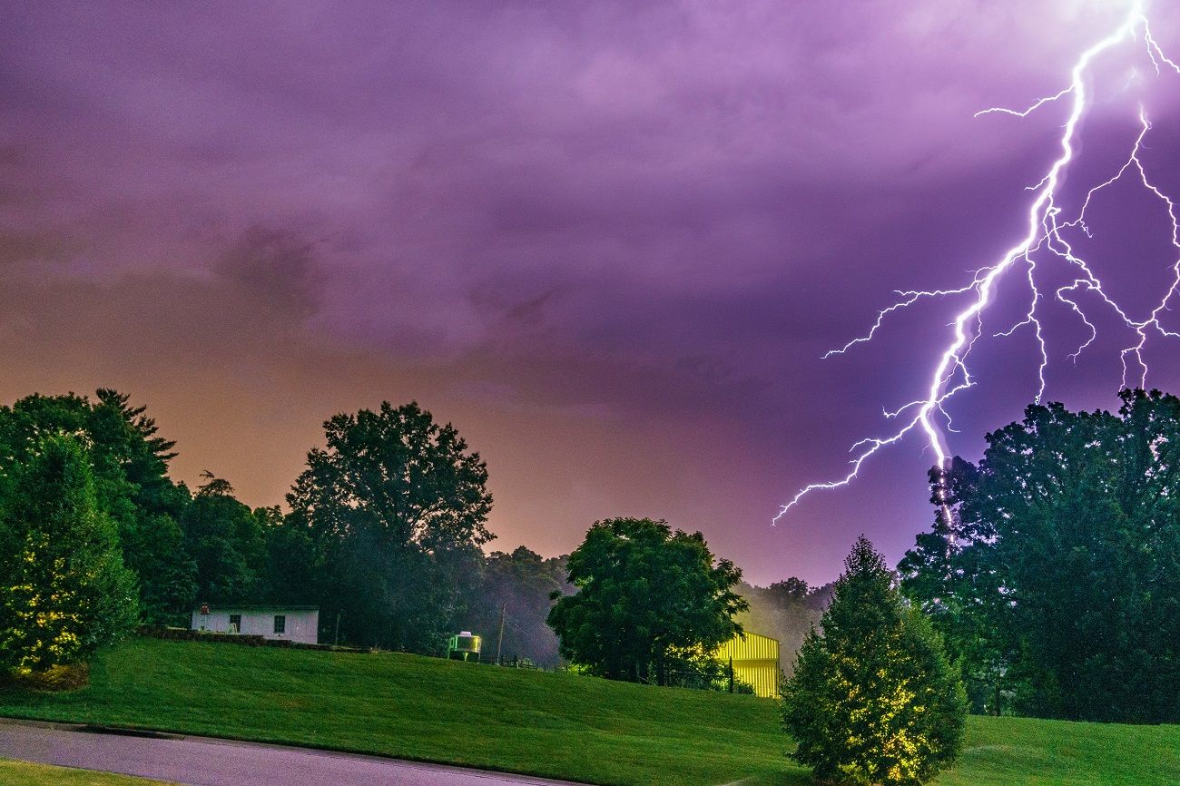 Lightning In Sky During Thunderstorm in Neighborhood