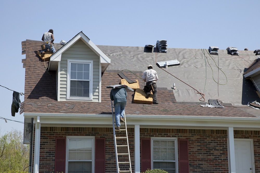 Roofers replacing roof