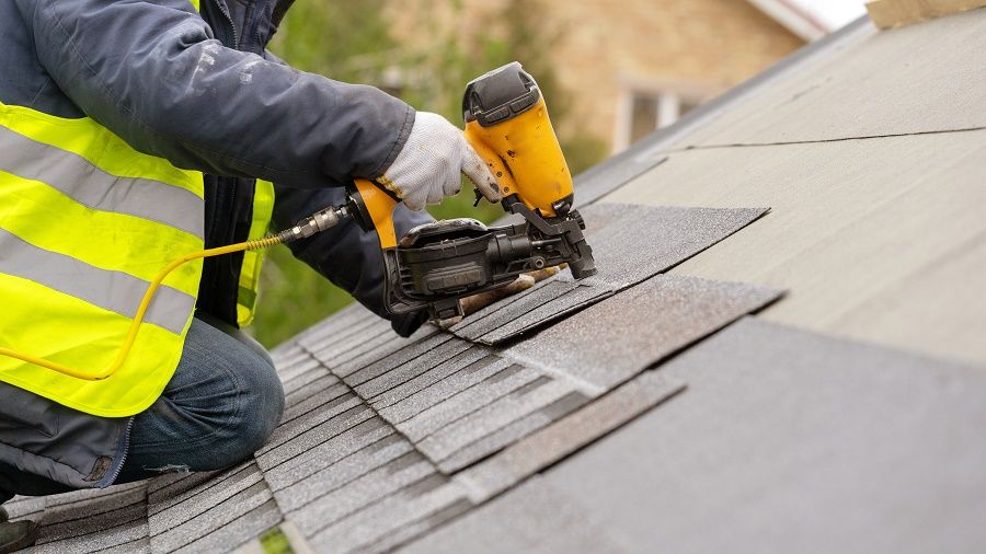 Roofer Repairing Roof