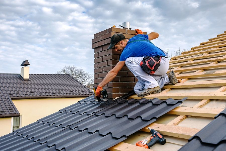 Roofer Installing New Roof Shingles