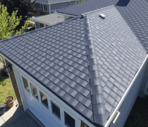 A modern suburban home with a newly installed, sleek roof.